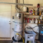 Water Heater Installation with new stand, all code updates and venting and laundry sink installation.